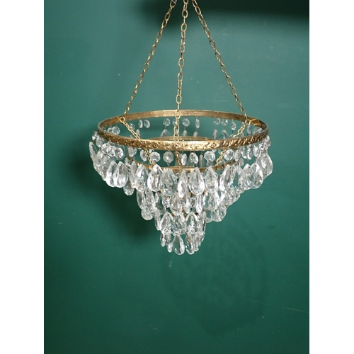 637 - A pair of glass four-branch Candelabra and a brass and glass graduated Light Fitting