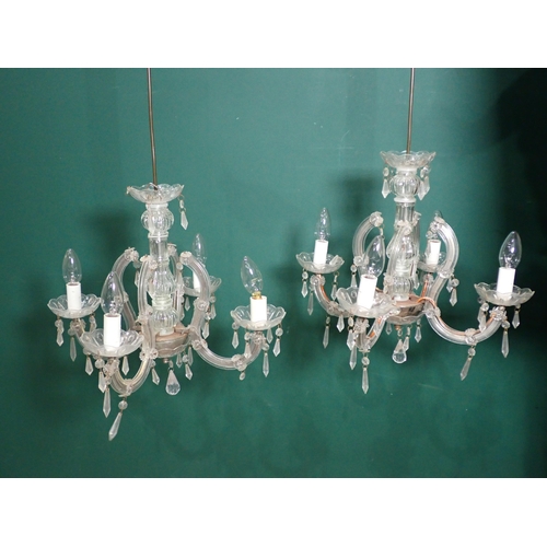 637 - A pair of glass four-branch Candelabra and a brass and glass graduated Light Fitting