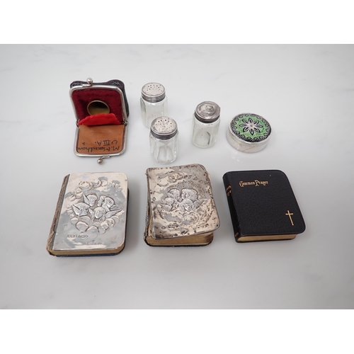 73 - A silver mounted Diary and Prayer Book, three small Pepperettes, a Thimble in Purse and a circular P... 