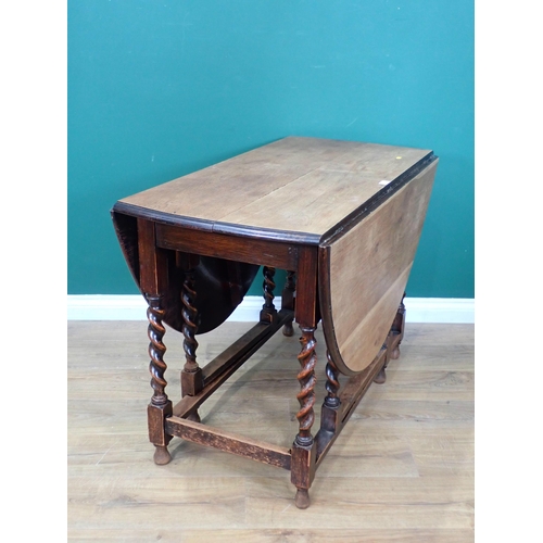 730 - An oak gateleg Dining Table on barley twist supports 3ft 5in W x 2ft 5in H