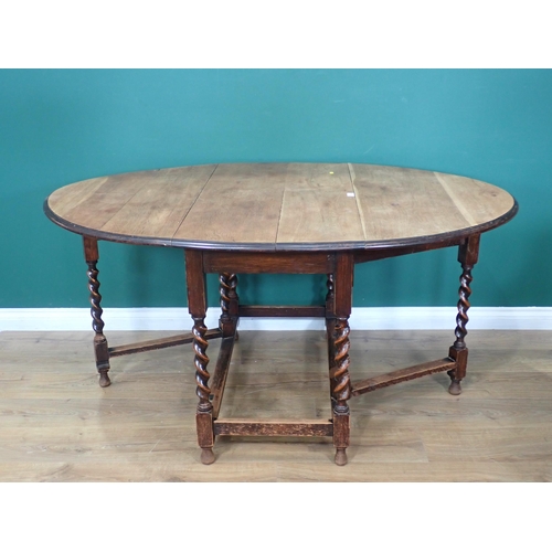 730 - An oak gateleg Dining Table on barley twist supports 3ft 5in W x 2ft 5in H