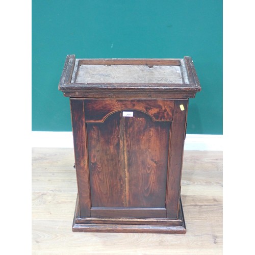 264 - An 18th Century oak Wall Cupboard with arched fielded panel door enclosing five drawers and shelves ... 