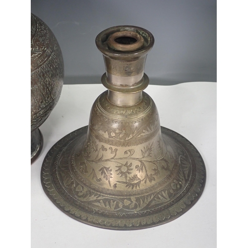 769 - An Eastern white metal Vase and an engraved Candlestick