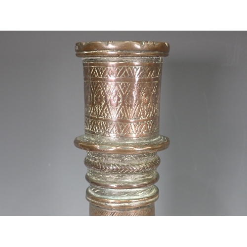 769 - An Eastern white metal Vase and an engraved Candlestick