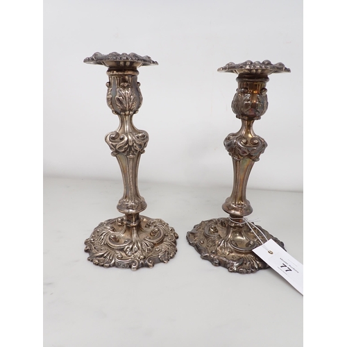 77 - A pair of George III silver Candlesticks with scroll decoration and engraved cockerel crests, Sheffi... 