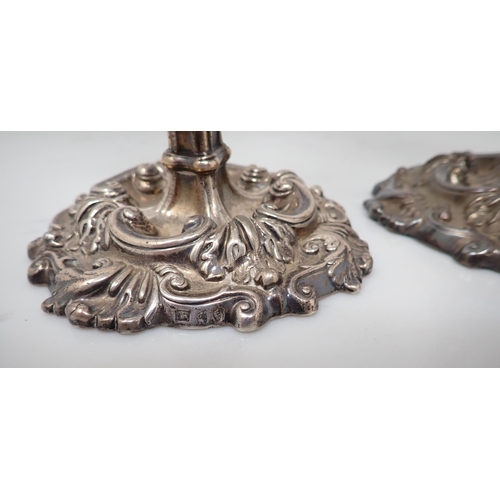 77 - A pair of George III silver Candlesticks with scroll decoration and engraved cockerel crests, Sheffi... 