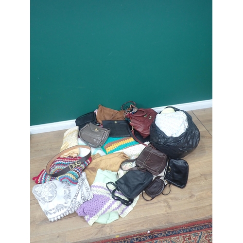 770 - Two bags of Blanket, leather Handbags and assorted Textiles