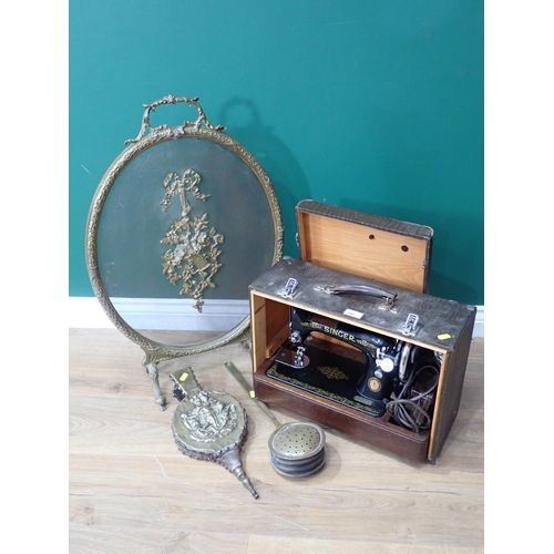 786 - A Singer Sewing Machine in case, a French brass Fire Screen, Bellows and a Chestnut Roaster