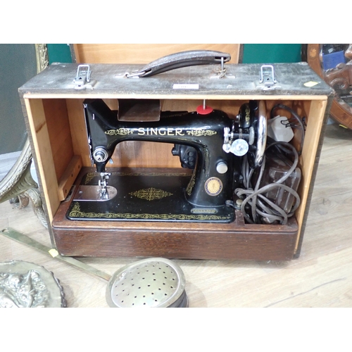 786 - A Singer Sewing Machine in case, a French brass Fire Screen, Bellows and a Chestnut Roaster