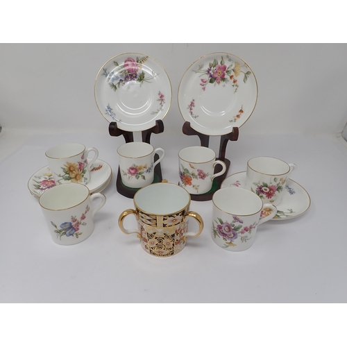 81 - A Royal Worcester Coffee Service for six, floral decorated, one saucer A/F, and a Royal Crown Derby ... 