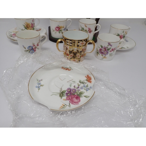 81 - A Royal Worcester Coffee Service for six, floral decorated, one saucer A/F, and a Royal Crown Derby ... 