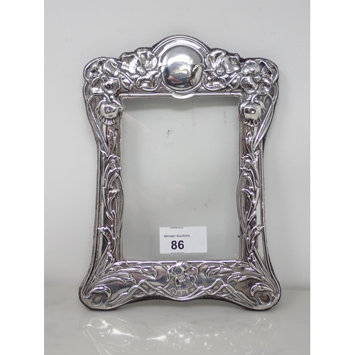 86 - A modern silver Art Nouveau style Photograph Frame with floral embossing, Sheffield 1988