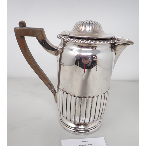 87 - A Victorian silver semi-fluted Hot Water Jug with gadroon rim, London 1899, 540gms all in