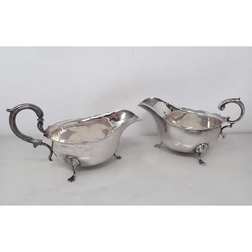 88 - A Victorian silver Sauce Boat with leafage scroll handle on hoof feet, Chester 1900, and another, Bi... 