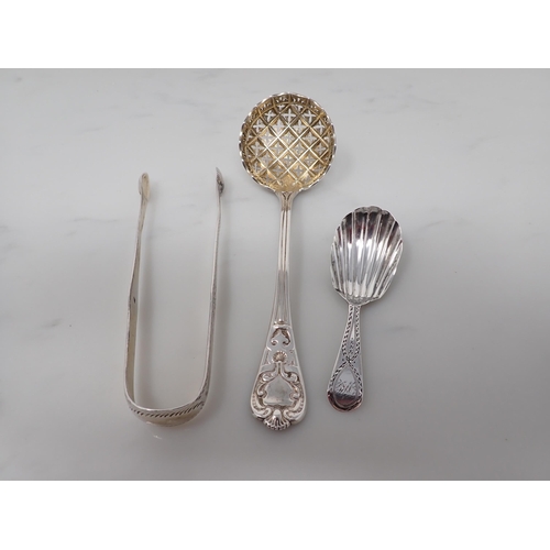 91 - A George III silver bright-cut Caddy Spoon, London 1799, a pair of Sugar Tongs, London 1796, and a S... 