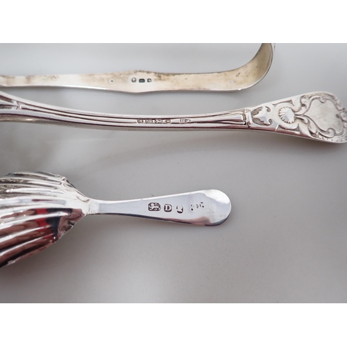 91 - A George III silver bright-cut Caddy Spoon, London 1799, a pair of Sugar Tongs, London 1796, and a S... 