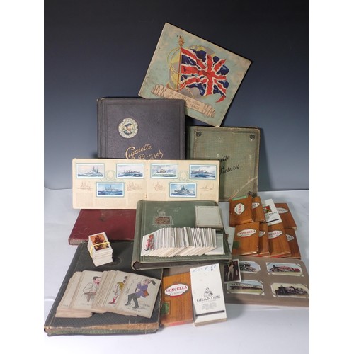 245 - A small collection of Cigarette Cards, subjects include coats of arms, National Flags (incomplete), ... 