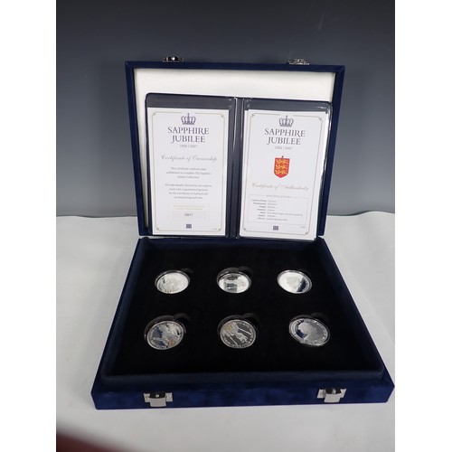 241 - A collection of boxed and carded British and World Coins, to include an Australia Anniversary Presti... 