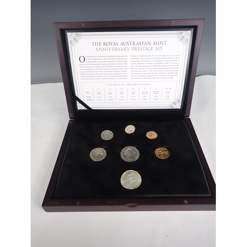 241 - A collection of boxed and carded British and World Coins, to include an Australia Anniversary Presti... 