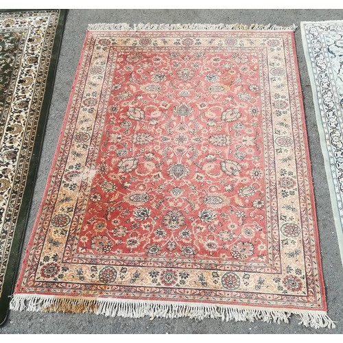 251 - A Persian style Rug decorated floral sprays on a red ground, 7ft 9in x 5ft 7in, moth damage and stai... 