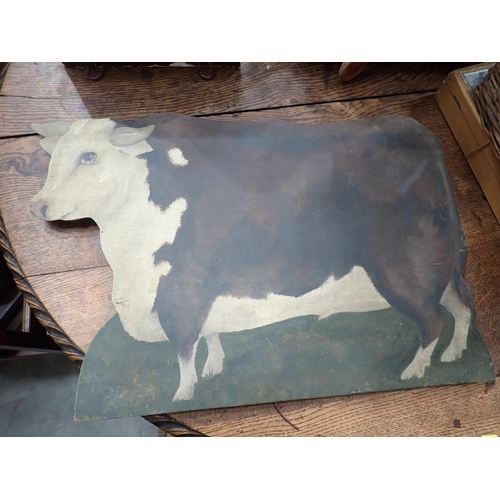 310 - An antique carved and painted Rocking Horse Head, a painted Screen in the form of a Hereford Cow and... 