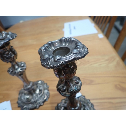 77 - A pair of George III silver Candlesticks with scroll decoration and engraved cockerel crests, Sheffi... 