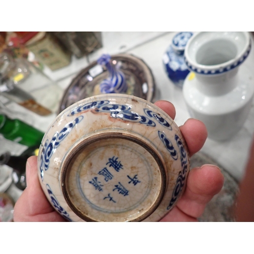 651 - A pierced metal Charger, a Chinese blue and white Vase with dragon design, 10in H, (chipped), a blue... 