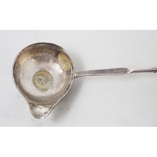 127 - A silver-gilt Spoon with mask and bird decoration, two silver Shooting Spoons, a Pusher, a Toddy Lad... 