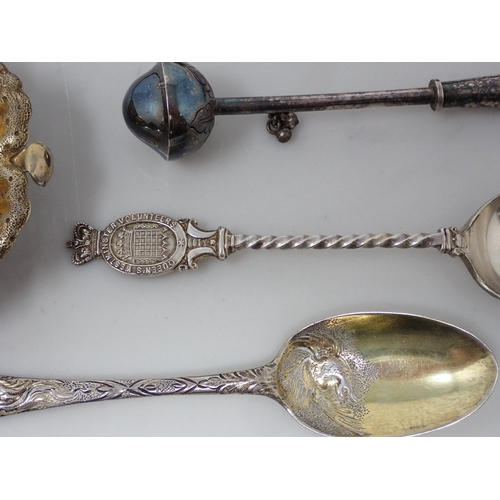 127 - A silver-gilt Spoon with mask and bird decoration, two silver Shooting Spoons, a Pusher, a Toddy Lad... 