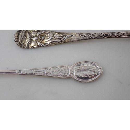 127 - A silver-gilt Spoon with mask and bird decoration, two silver Shooting Spoons, a Pusher, a Toddy Lad... 