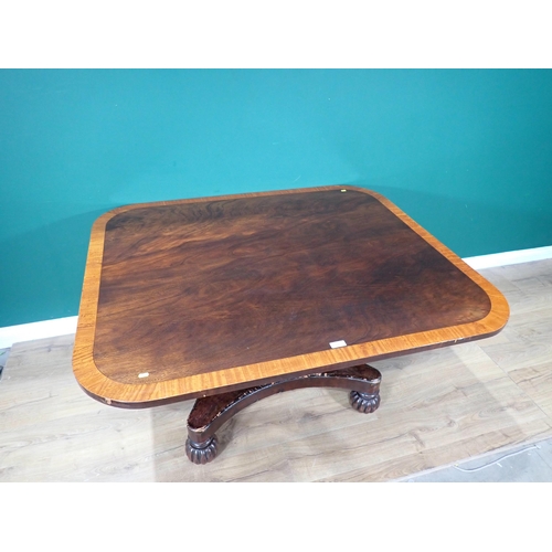 15 - A 19th Century walnut and satinwood crossbanded Breakfast Table on octagonal tapering column and con... 