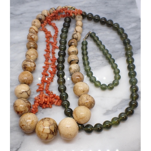 185 - A string of graduated Beads (possibly fossil coral), a string of Coral beads and a Lapland Jade bead... 