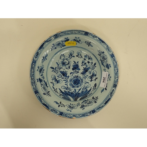 204 - A small 19th Century Delft Dish, decorated floral designs, 7 3/4in diam.