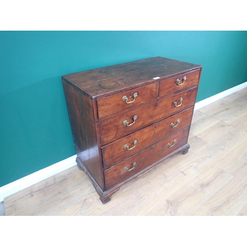 313 - A Georgian mahogany Chest of two short and three long drawers mounted upon ogee bracket feet 3ft 2in... 