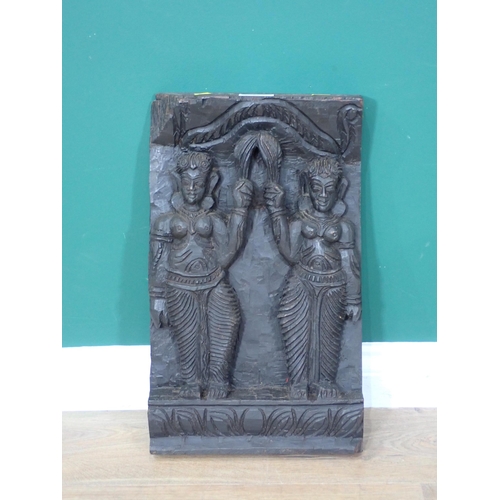 32 - An Eastern carved hardwood Panel depicting two figures 19in x 12in