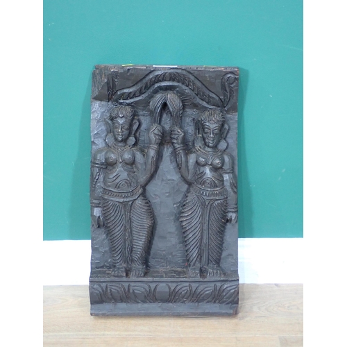 32 - An Eastern carved hardwood Panel depicting two figures 19in x 12in