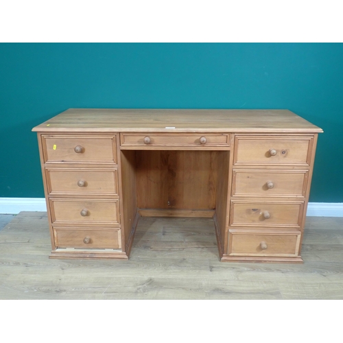 328 - A modern pine Desk fitted nine drawers 4ft 8in W x 2ft 6in H