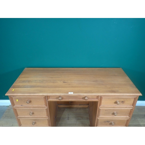 328 - A modern pine Desk fitted nine drawers 4ft 8in W x 2ft 6in H