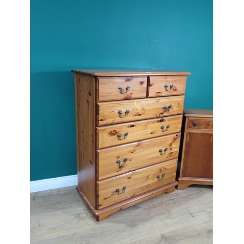 329 - A modern pine Chest of two short and four long drawers 3ft 6in H x 2ft 9in W and a yew veneered Cupb... 