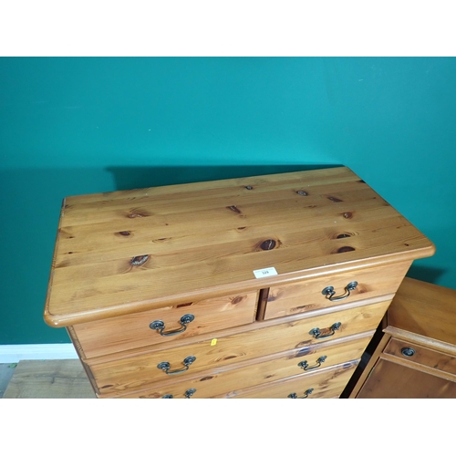 329 - A modern pine Chest of two short and four long drawers 3ft 6in H x 2ft 9in W and a yew veneered Cupb... 