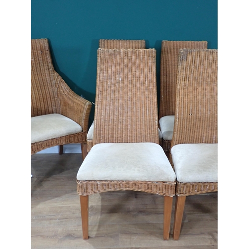 333 - A set of six wicker Dining Chairs with cream upholstered seats