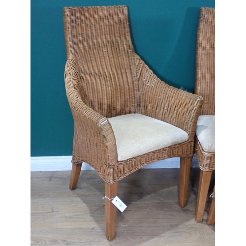 333 - A set of six wicker Dining Chairs with cream upholstered seats