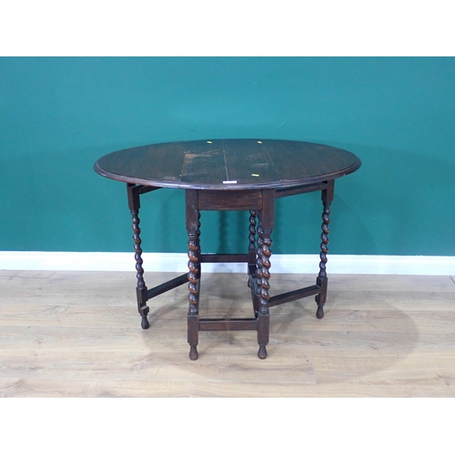 334 - An oak gateleg Table on barley twist supports 2ft 6in W x 2ft 5in H