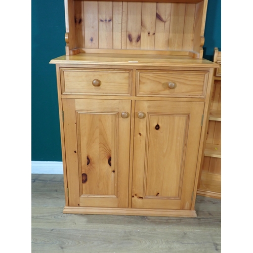 338 - A modern pine Kitchen Dresser and Rack fitted two drawers above pair of cupboard doors 6ft 1in H x 2... 