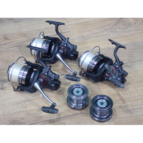 35 - Three Daiwa Windcast BR5000 Fixed Spool Reels with spare spools, Spods and Rod Rests in Nash Monster... 