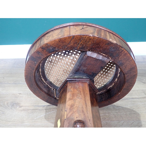 355 - A Victorian mahogany adjustable Stool with cane seat mounted on hexagonal column and triform base wi... 