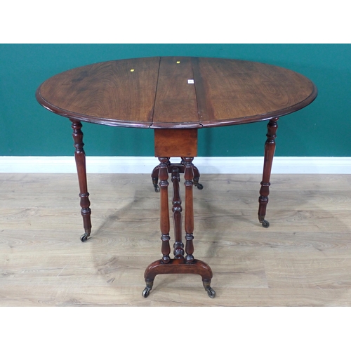 385 - A Victorian mahogany oval Sutherland Table mounted on turned supports and casters 3ft W x 2ft 4in H