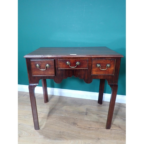 392 - A George III mahogany Lowboy with moulded top fitted three frieze drawers above shaped apron mounted... 