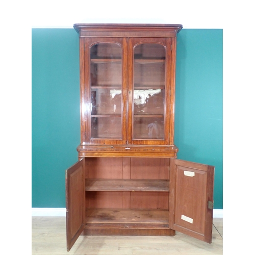 393 - A 19th Century mahogany Bookcase fitted pair of glazed cupboard doors above base fitted pair of pane... 