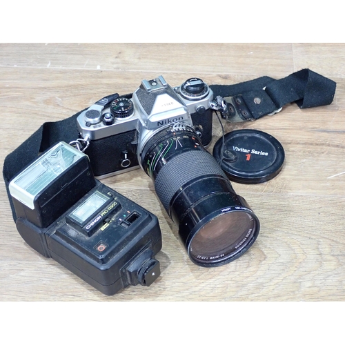 4 - A Nikon FE4000478 Camera and Lens, pair of Binoculars and a Zeiss Monocular in leather case